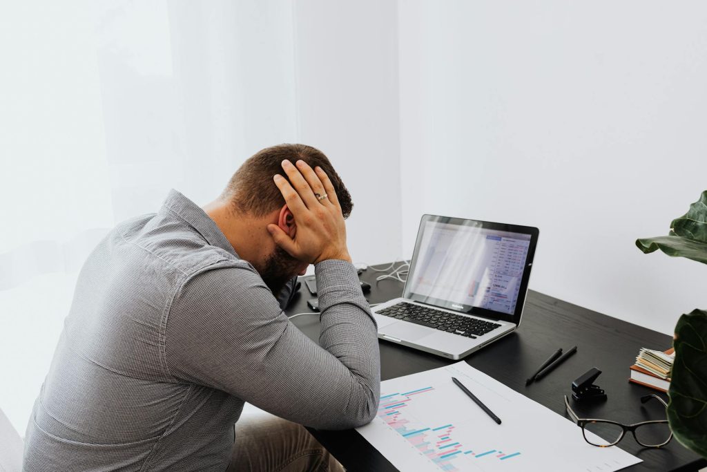 A stressed man dealing with an employment dispute